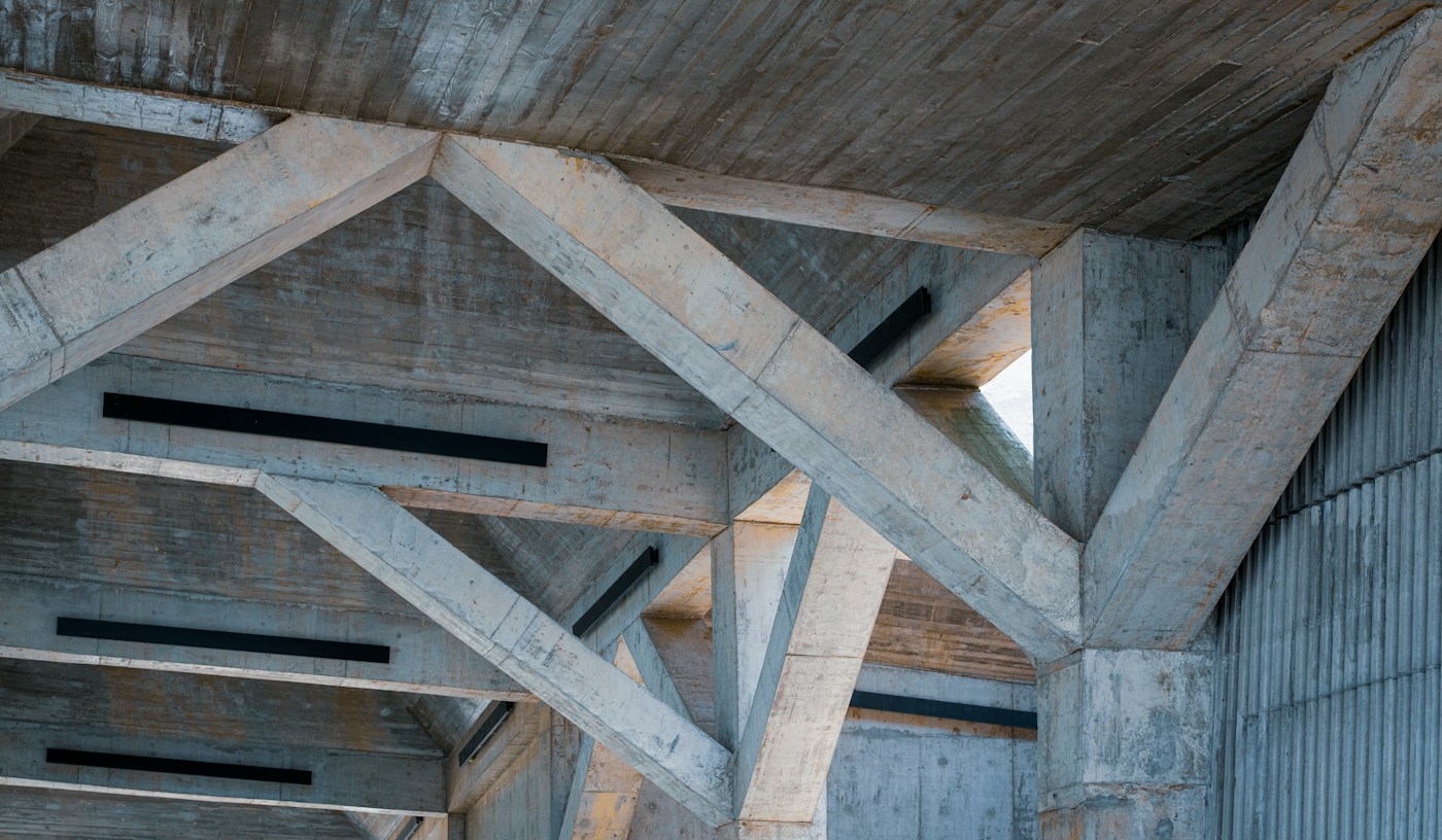 Illustrative photograph of concrete structural beams and architectural geometry